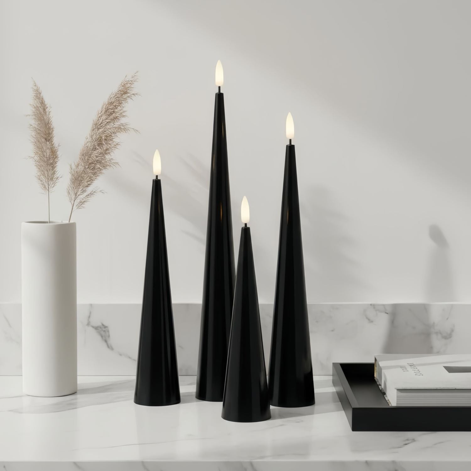Black cone-shaped candles on a table with decorative elements.#color_shiny-black