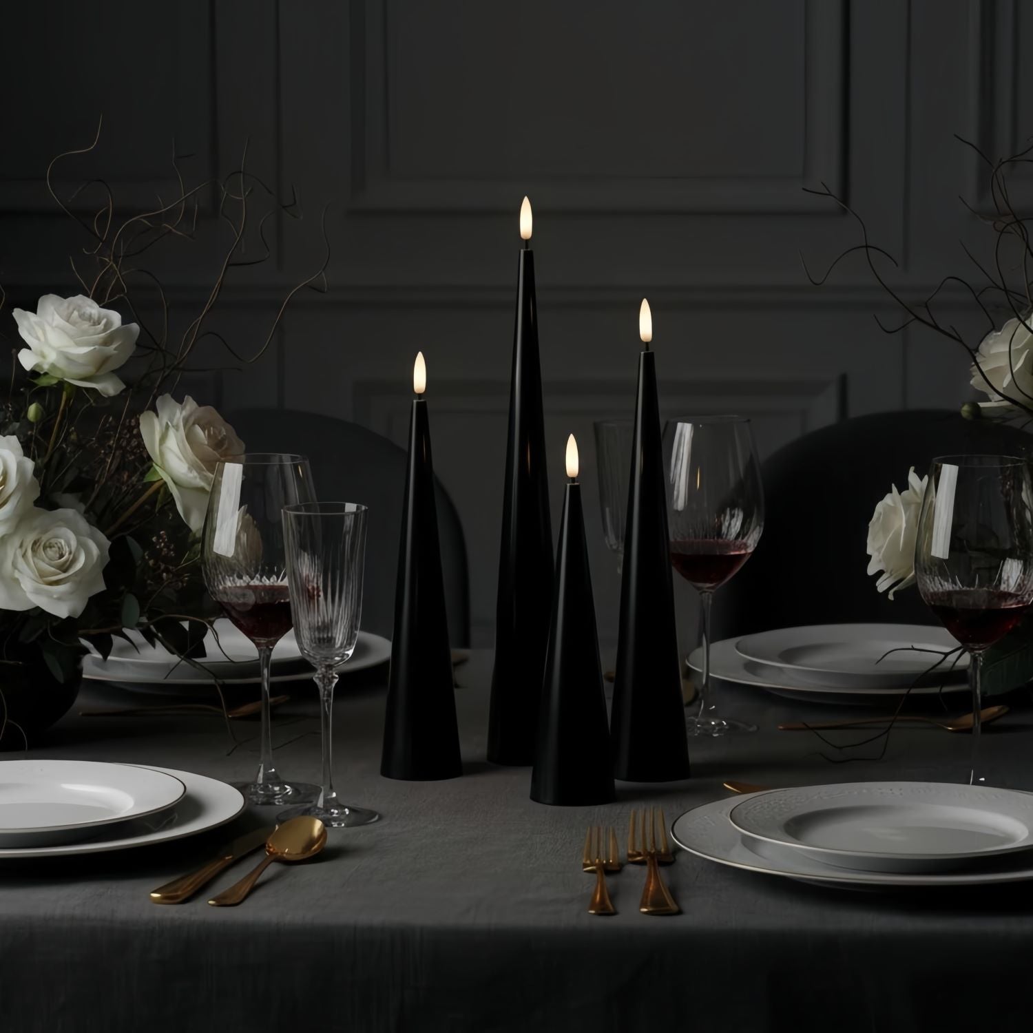 Black candles on a wooden base with a Christmas tree in the background#color_shiny-black