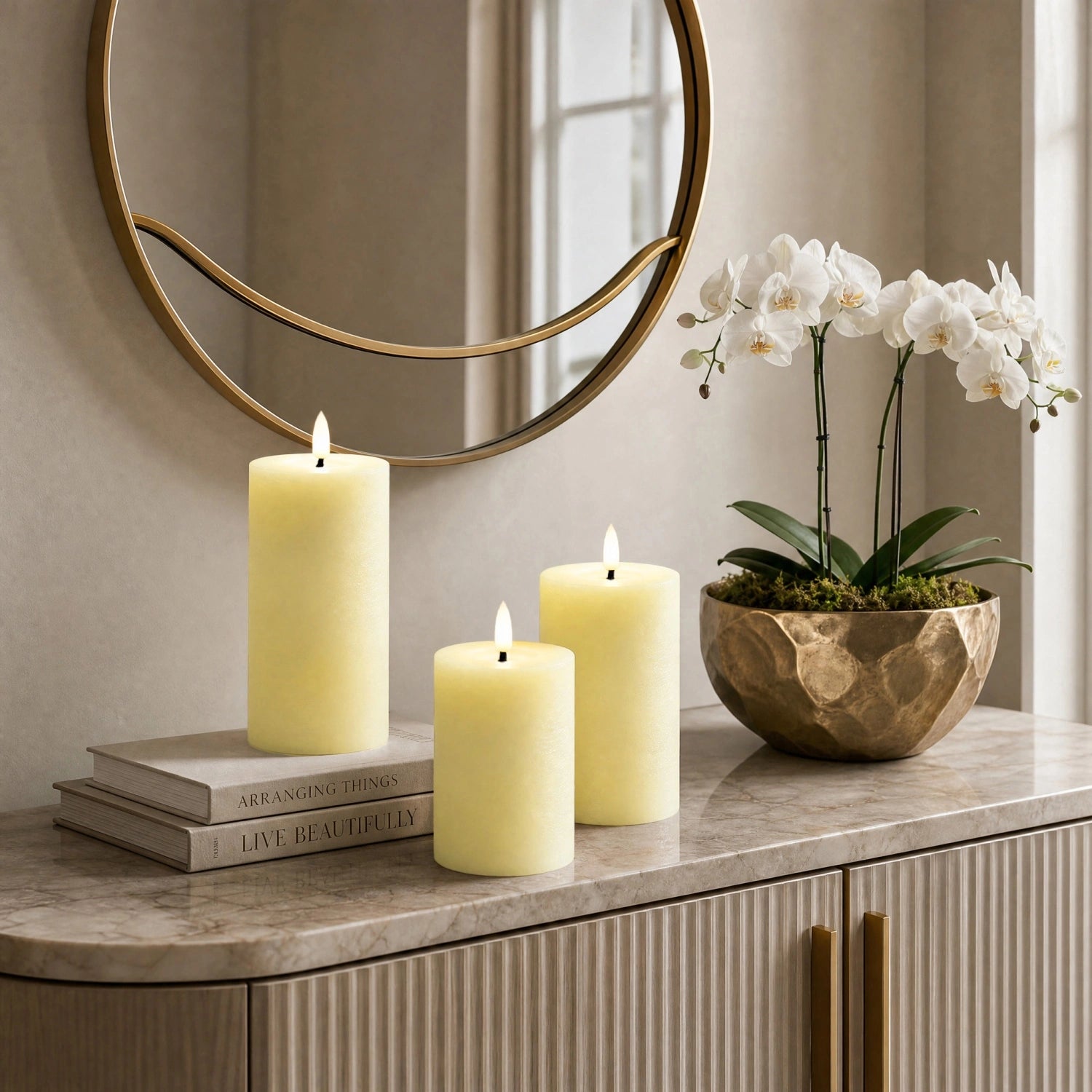 Decorative setup with candles and a plant on a marble surface, featuring a round mirror in the background.