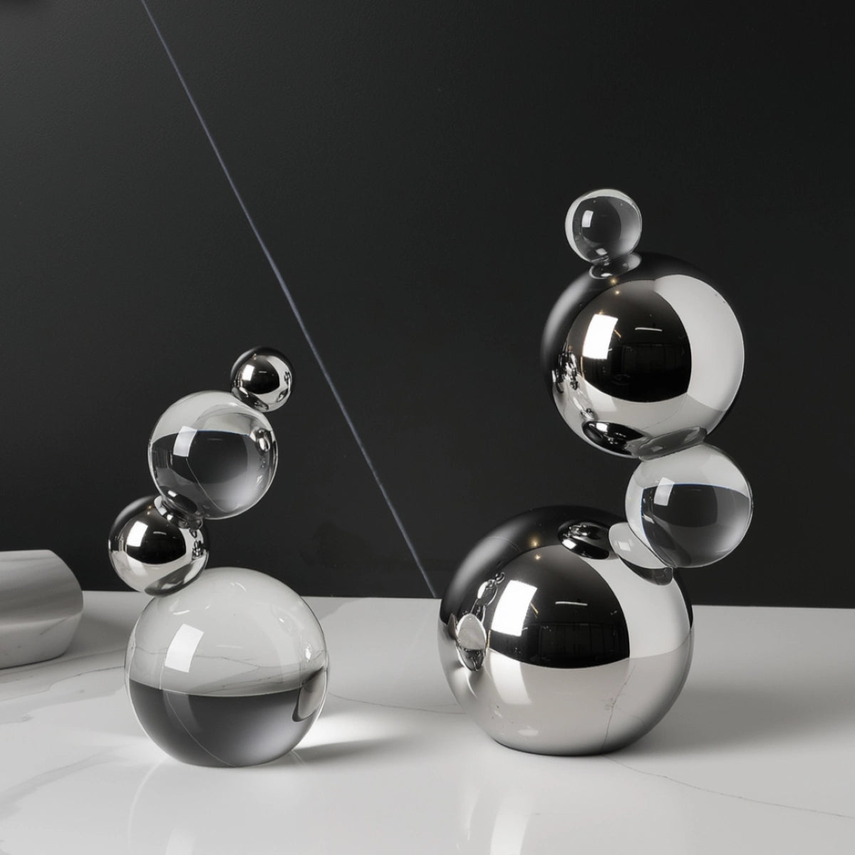 Set of metallic spherical objects on a reflective surface with a dark background