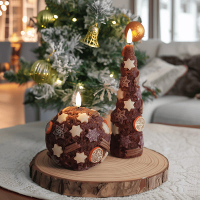 Decorative candles on a wooden base with a Christmas tree in the background