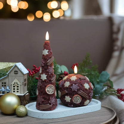 Decorative candles on a wooden base with a Christmas tree in the background