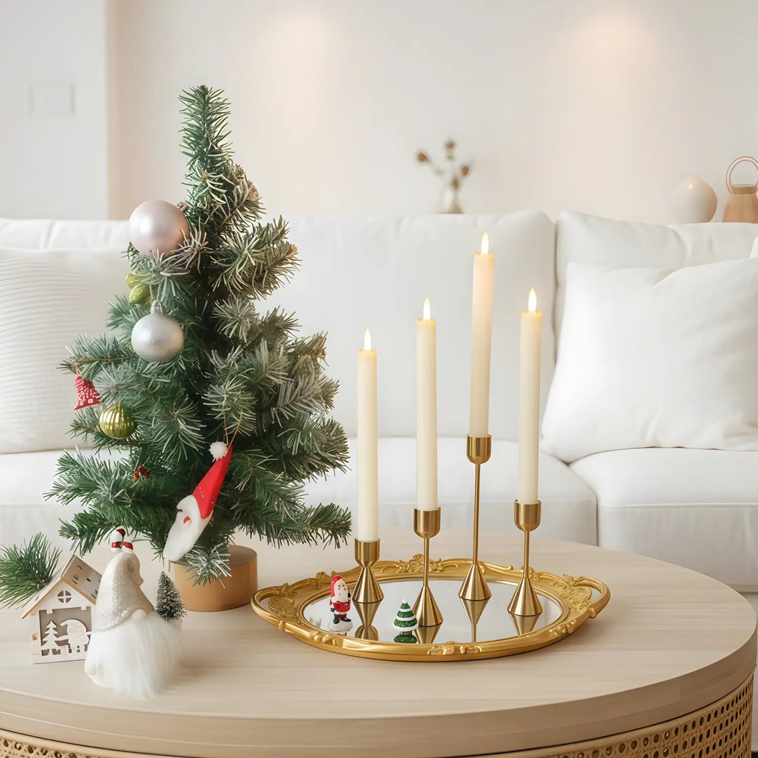 Set of gold candle holders on a white surface with a book titled 'Life' in the background.
