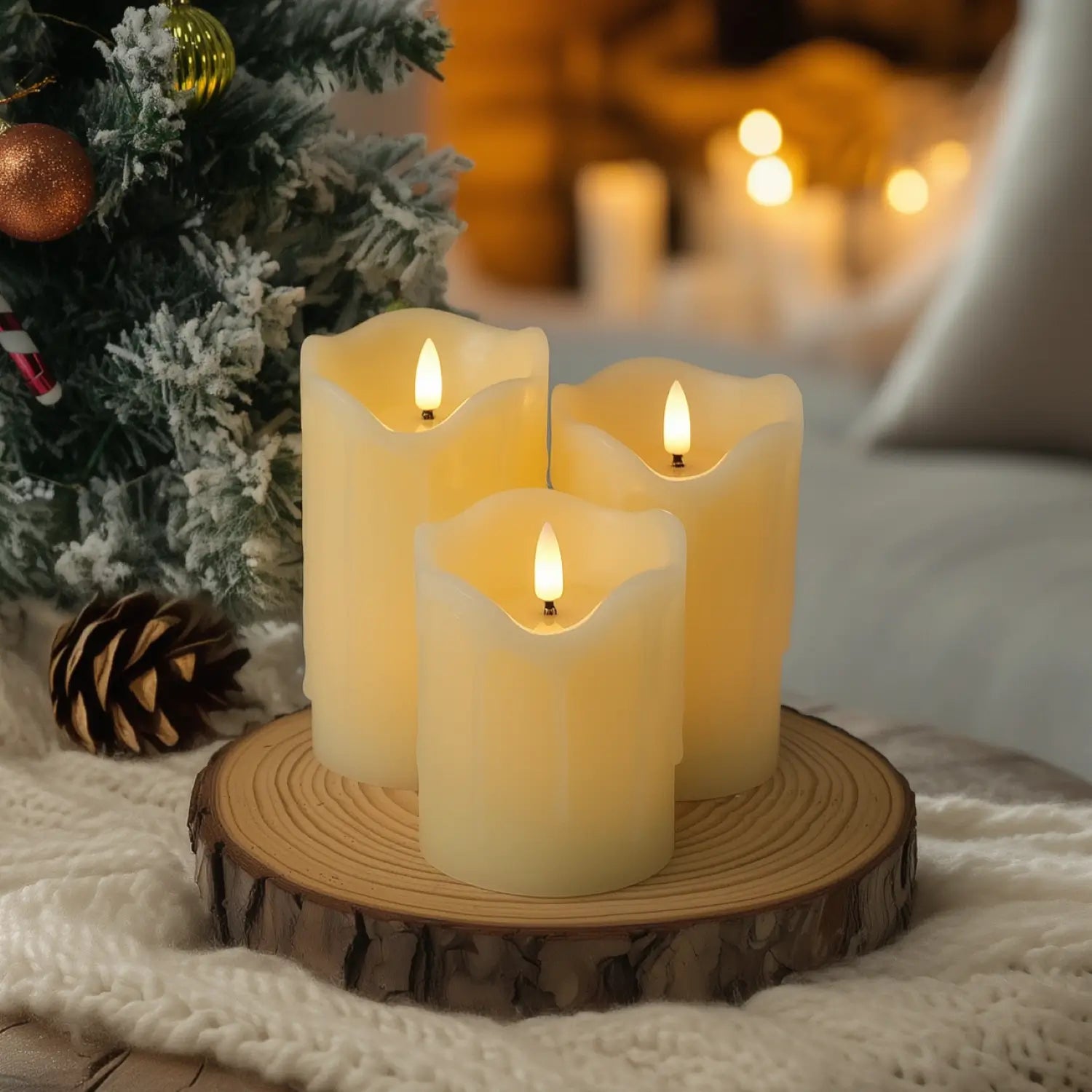 Decorative candles with greenery and berries on a table with blurred lights in the background#color_ivory