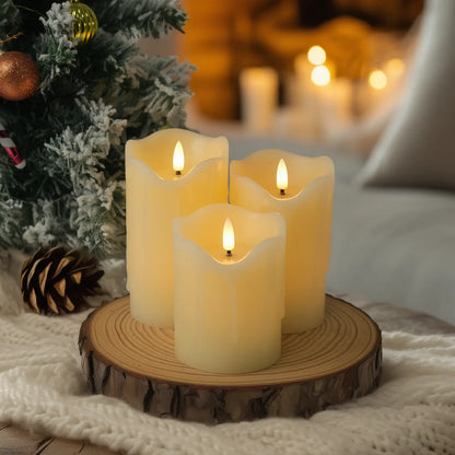 Decorative candles with greenery and berries on a table with blurred lights in the background
