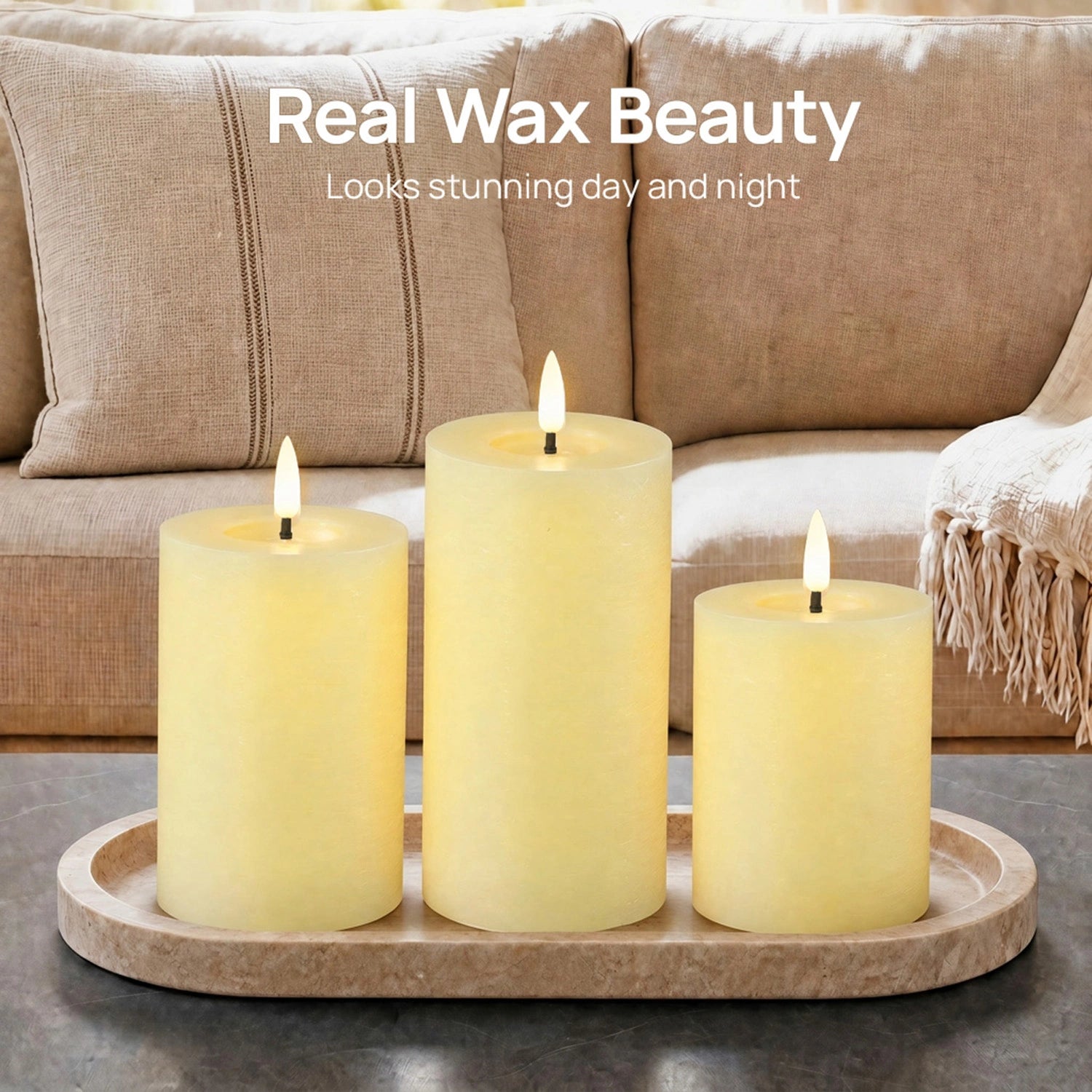 Three lit candles on a wooden tray in front of a beige sofa with text 'Real Wax Beauty Looks stunning day and night'.#color_rustic-ivory