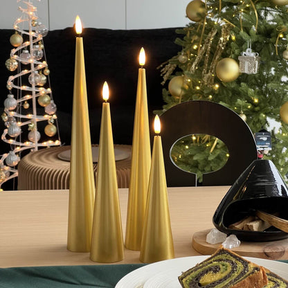 Decorative setup with gold candles, flowers, and greenery on a marble surface.