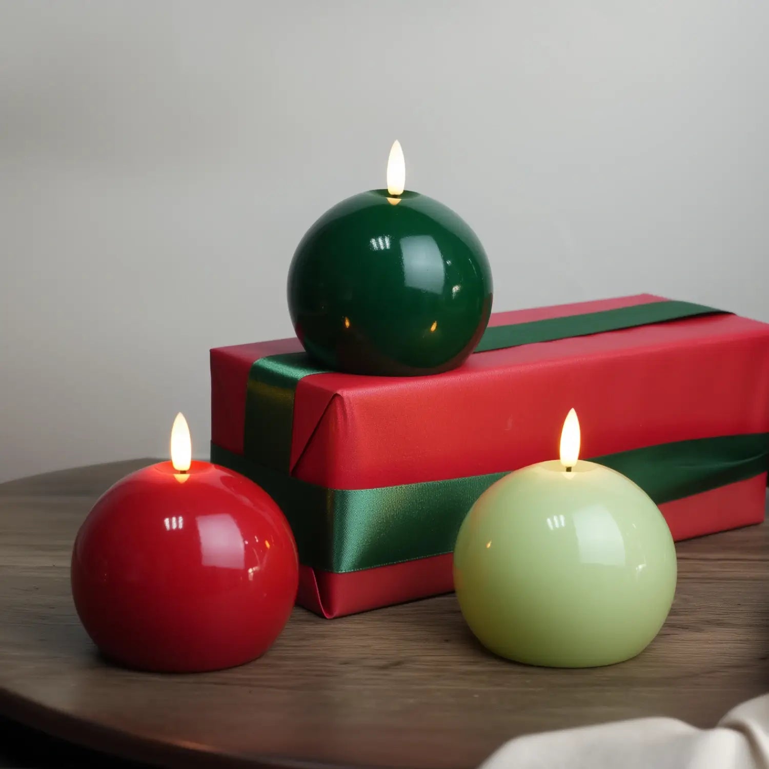 Green candle on a white plate with a white napkin