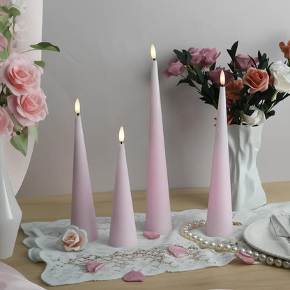 Set of three pink candles on a surface with decorative items in the background