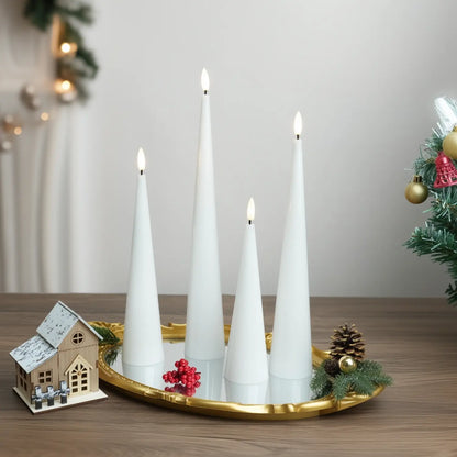 Decorative setup with white candles, pumpkins, and a skull on a neutral background