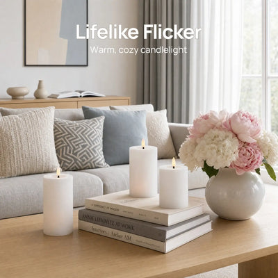 Living room with candles, books, and flowers on a table, featuring 'Lifelike Flicker' text.